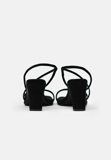 A pair of 1 People Vegas LAS - High Heels - Onyx with low, square recyclable plastic heels viewed from the back on a white background.